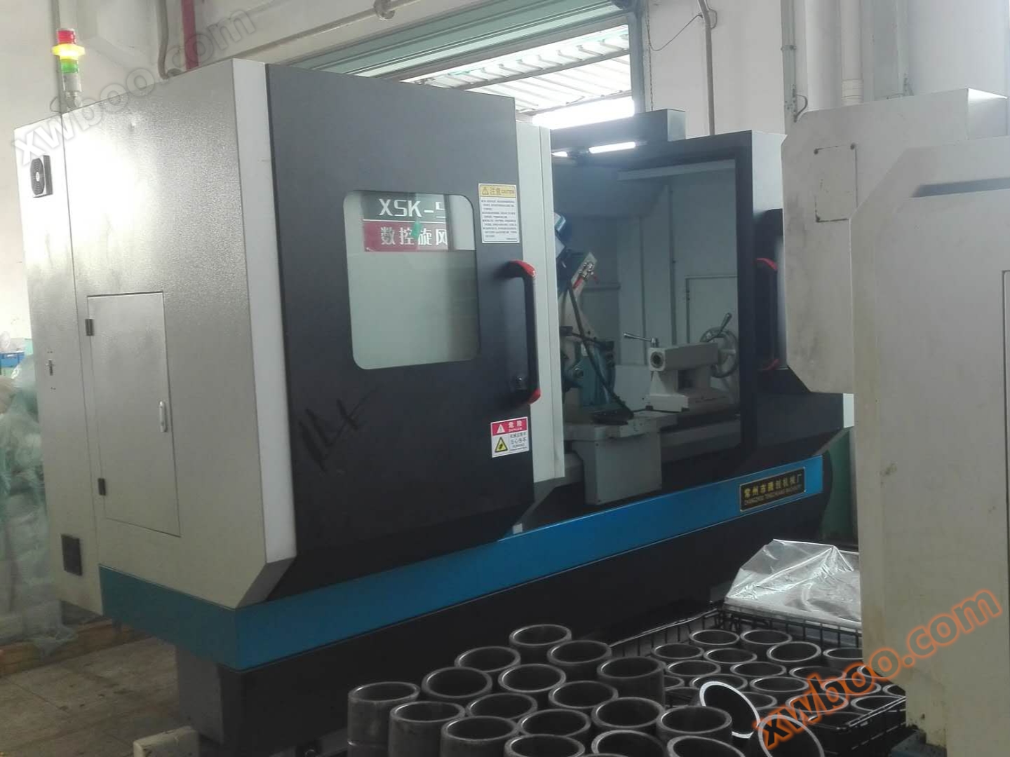 Rainure d'huile courbée CNC cyclone fraisage machine complète Fujian Longxi Bearing Group site client